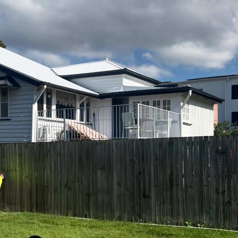 Before: a Queenslander home before and after a hedge row was planted along the side boundary fence