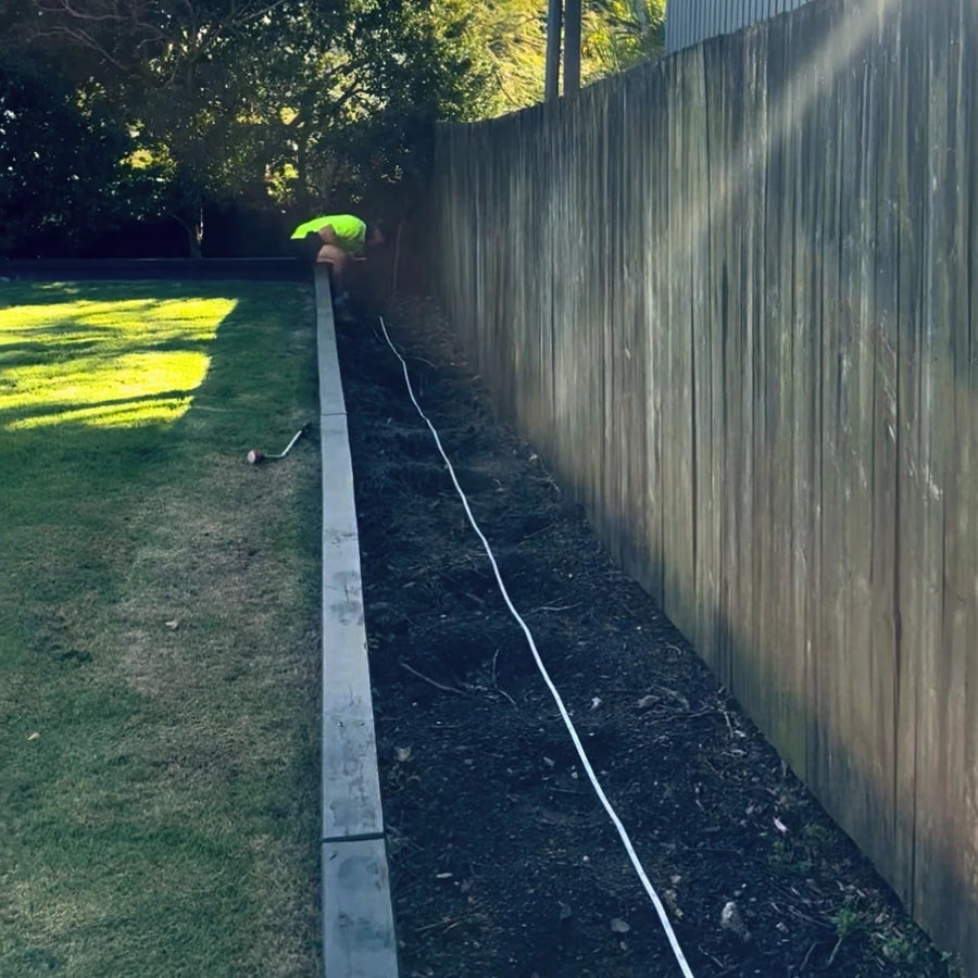 Before: Our crew preparing the side boundary bed, then the planted Lilly Pilly screen along the same fence